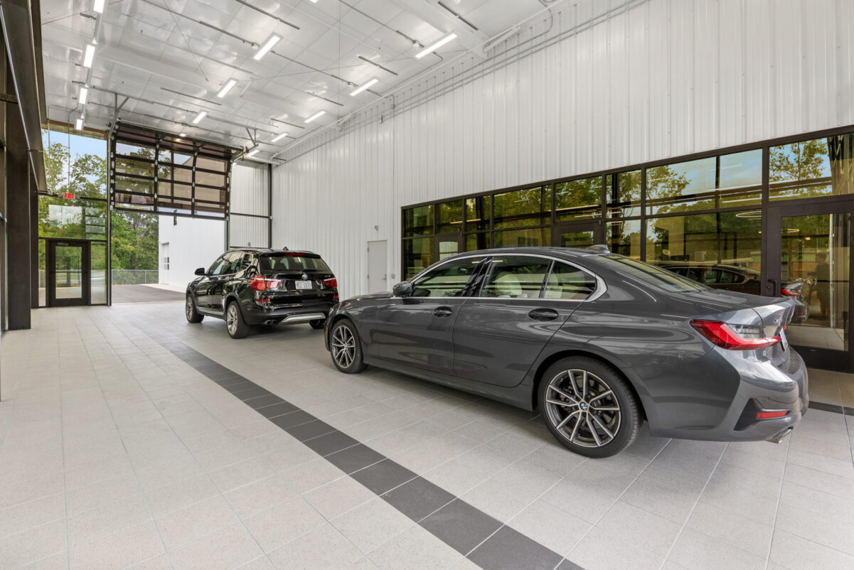 BMW vehicles displayed inside the Bimmer Performance Center showroom